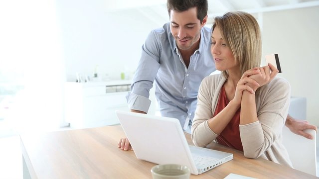 Couple at home buying on internet