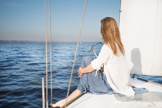woman sitting on sailboat