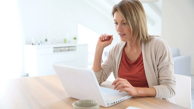 Businesswoman working from home in laptop computer