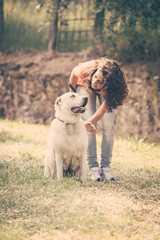 Young Woman Walking with Her Dog