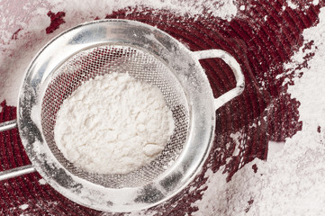 Wheat flour in a sieve