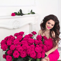 Enjoying beautiful woman with gorgeous roses bouquet, valentines
