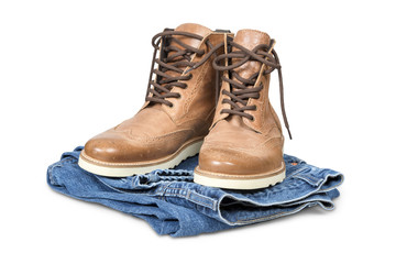 Hiking boots and blue jeans isolated with clipping path.