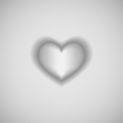 Isolated white heart on gray background.