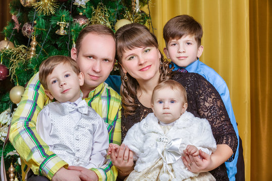 Portrait Of Friendly Family On Christmas Evening