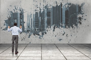Composite image of businessman posing with hands up