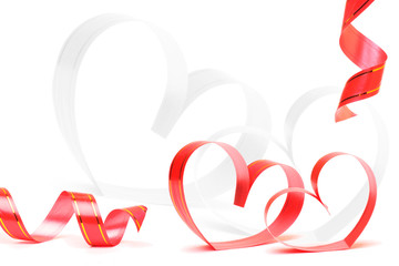 Ribbons shaped as hearts on white, valentines day concept