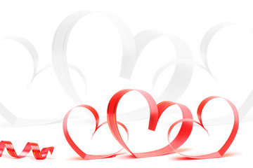 Ribbons shaped as hearts on white, valentines day concept