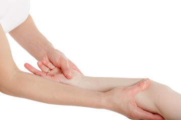 Massage therapist performing hand massage.