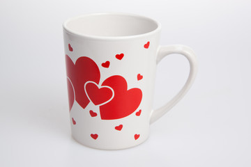 White cup with red heart