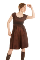 latin woman brown dress hand up