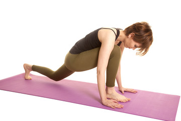 latin woman green leggings stretch on mat