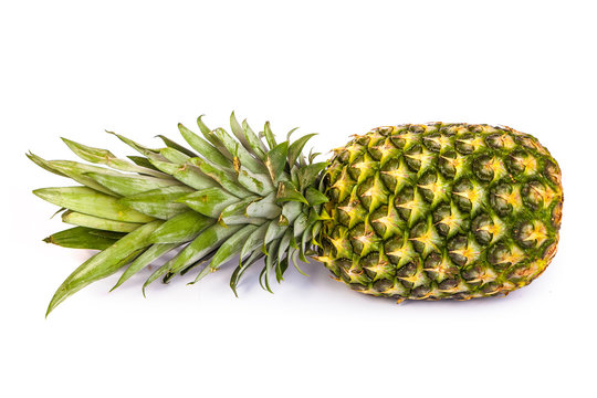 Single pineapple isolated on white