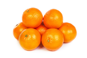 Group of ripe tangerine or mandarin with slices on white