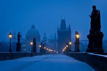 Famous Prague Charles bridge empty at early morning blue hour