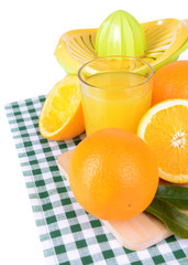 Citrus press and oranges isolated on white