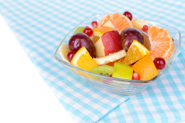Sweet fresh fruits in bowl on table close-up