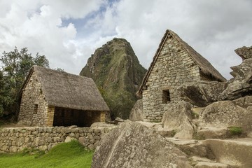 Ruins of two houses and Wayna Picchu in Machu Picchu
