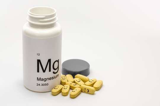 Open bottle of Magnesium vitamins