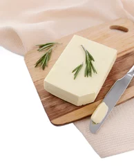 Foto op Plexiglas Tasty butter on wooden cutting board, isolated on white © Africa Studio