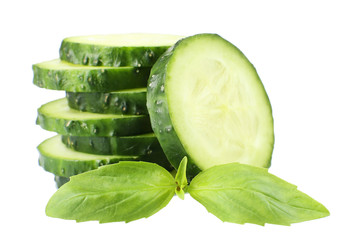 Sliced fresh cucumber with basil, isolated on white