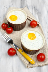 Baked eggs on table close up
