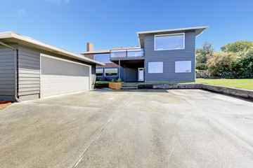 Naklejka premium Backyard view. Garage and drive way