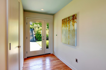 Brightt hallway with glass entrance  door