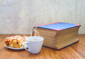 home made pizza coffee and book on table