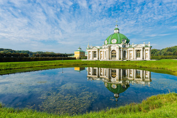 The Grotto Pavilion with reflection in water in park Kuskovo, Mo - obrazy, fototapety, plakaty