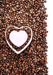 Roasted Coffee Beans with Heart Shaped Paper Sticker over coffee