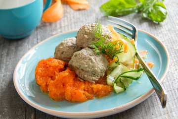 Meat dumplings with carrot puree