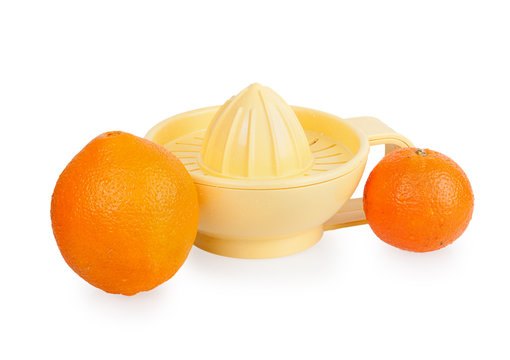 Orange plastic citrus juicer and oranges