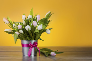 Bright tulips in decorative pot