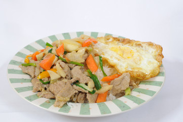 Cooked rice and mix vegetables with fried egg.