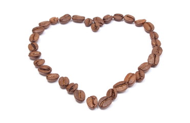 Heart shaped coffee beans on white background