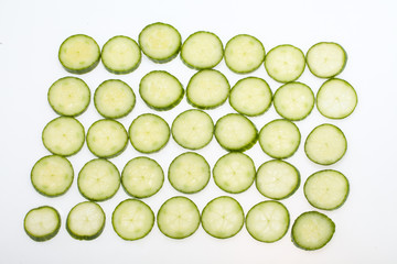 Freshly sliced cucumber  isolated on white background