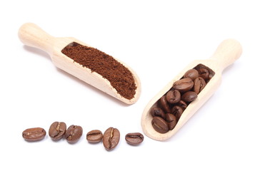 Brown coffee on wooden spoon. White background