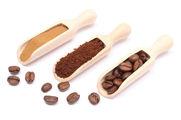 Grains, ground and instant coffee on wooden spoon
