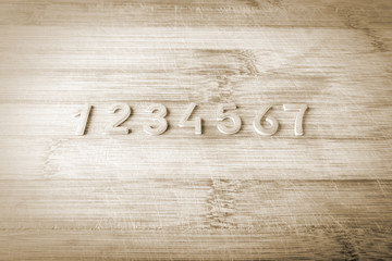 Number from one to seven on a wooden background