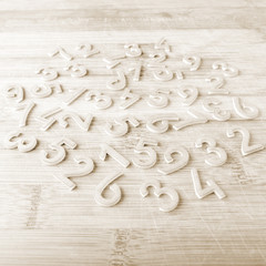Number scattered on wooden table