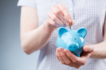 Young Person Adding Cash to Savings