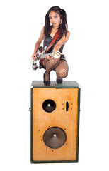 rock musician doing squat at loud-speaker