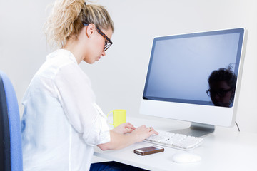 Young woman working from home on the computer