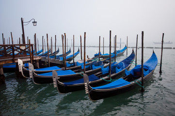Fototapeta na wymiar Gondolas in lagoon of Venice