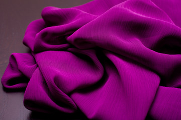 purple, violet tender colored textile, elegance rippled material