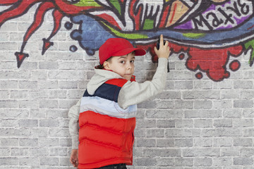 Fototapeta na wymiar Making Graffiti on a brick wall