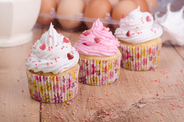 Cupcakes with white and pink cream