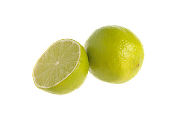 A half and a whole lime on the white  isolated