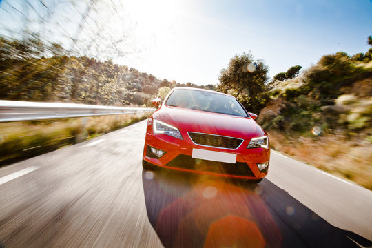 Fototapeta Car on a road full of dangerous bends
